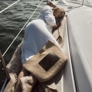 Raffia clutch bag by Janessa Leone